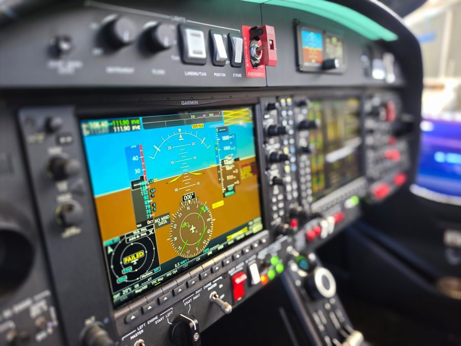 A modern glass cockpit with digital navigation displays