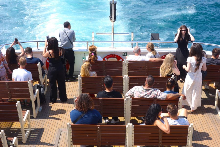 Passengers on the deck of a tour boat